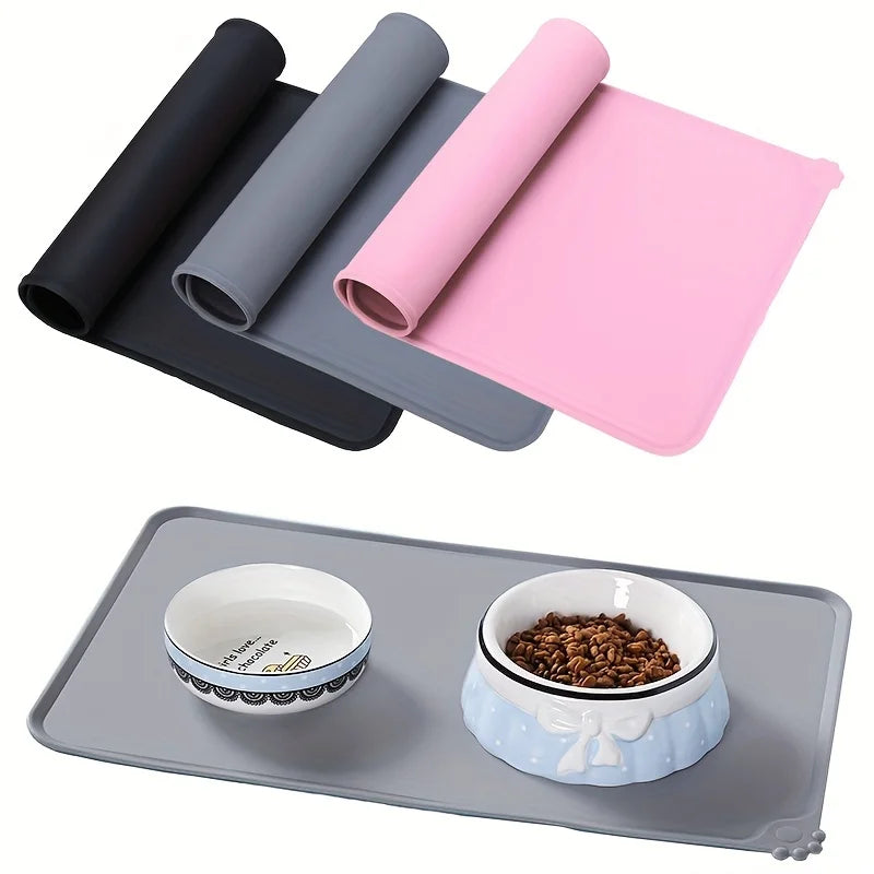 Silicone Pet Food Mat in multiple colors, showcasing a waterproof feeding tray with pet bowls and food.